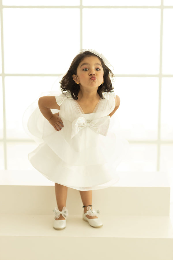 KNEE LENGTH TAILBONE DRESS WITH DRAPPED BOSSOM AND A BIG BOW